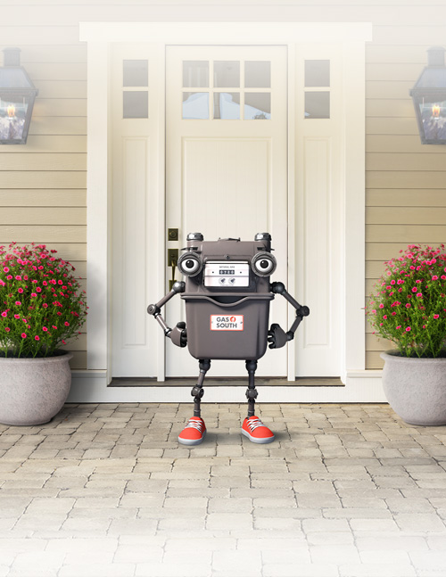 Mr. Meter in front of a house during spring