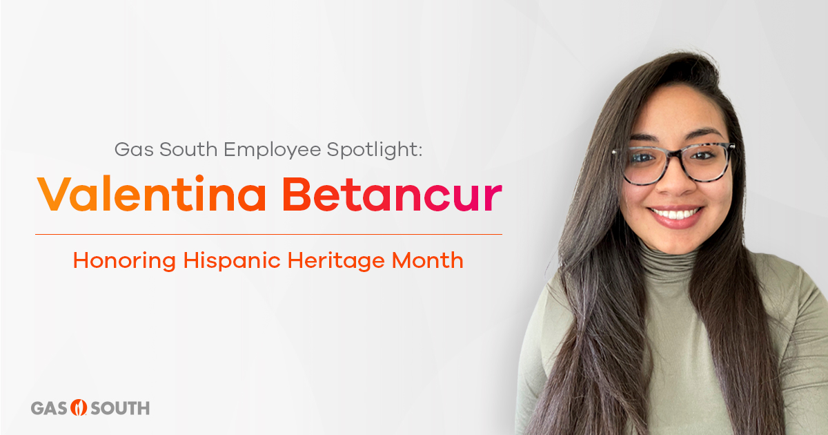 Hispanic women wearing a green shirt and glasses being honored for Hispanic Heritage Month.