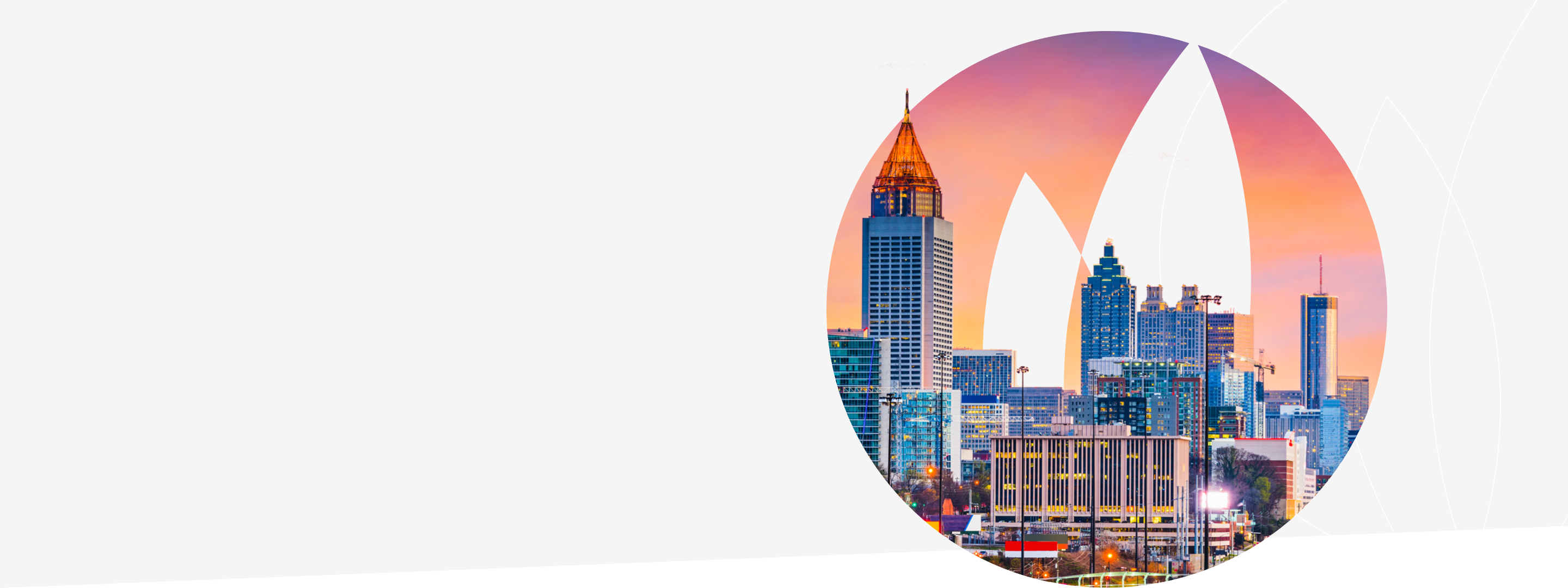 Atlanta city skyline against Gas South logo flame