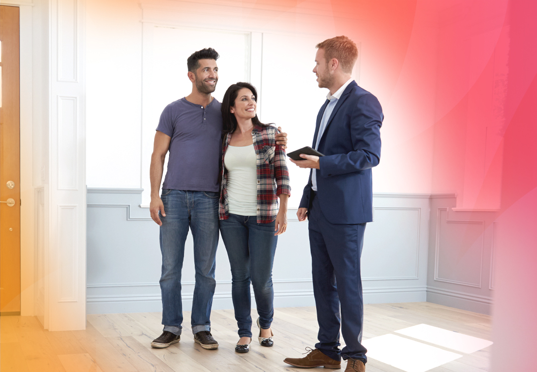 A couple touring a home with a real estate agent