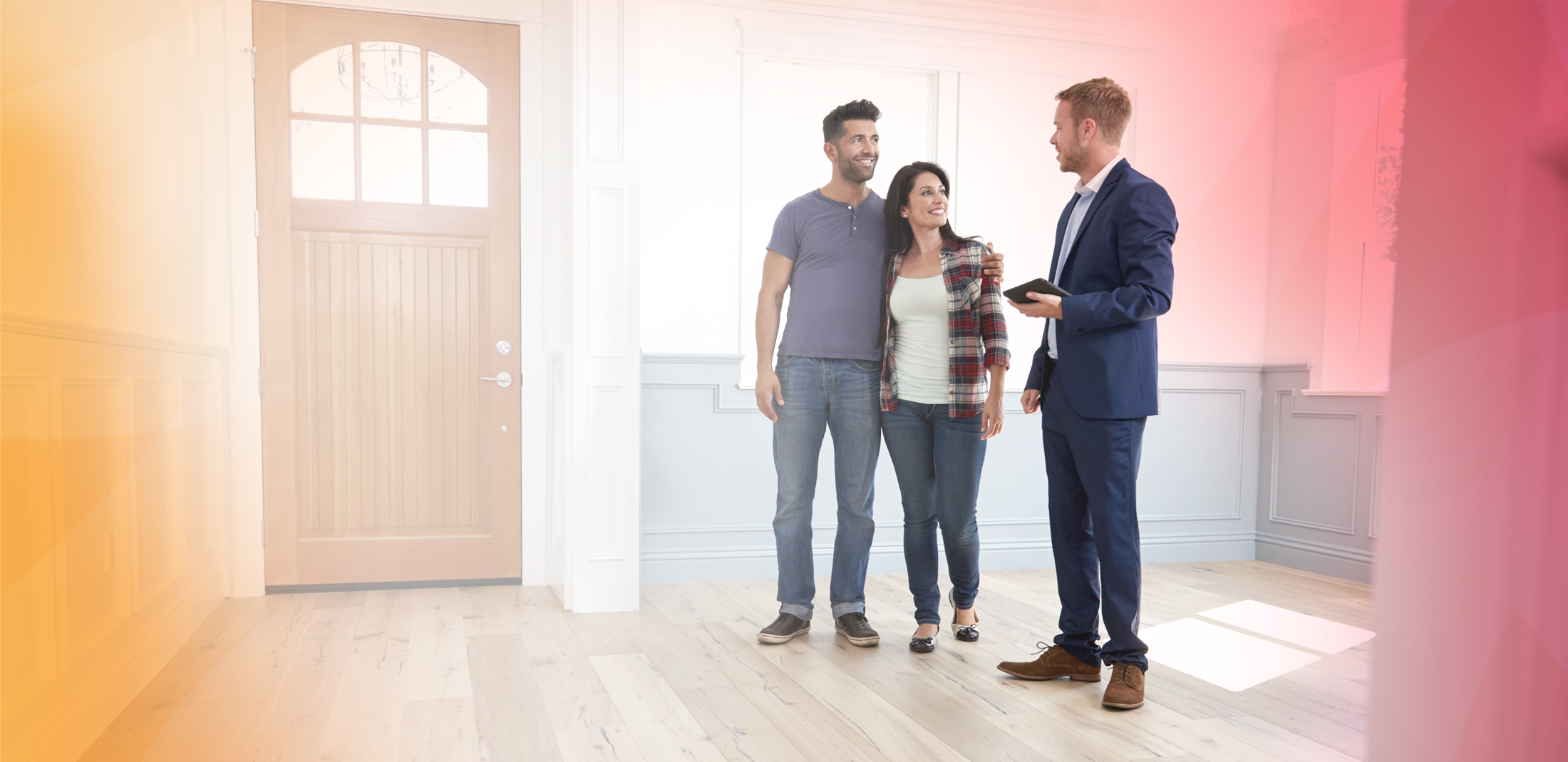 A couple touring a home with a real estate agent