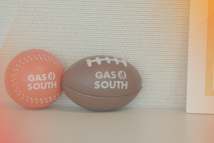 smiling gas south employees pose for a photo